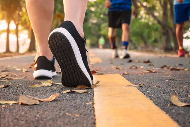 A close-up image of people walking on a fall day