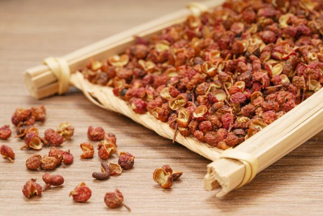 An image of spices on a wooden tray