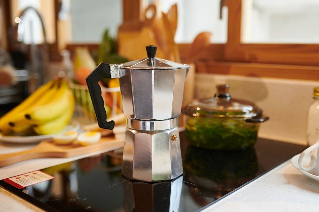 An image of a moka pot on the stove