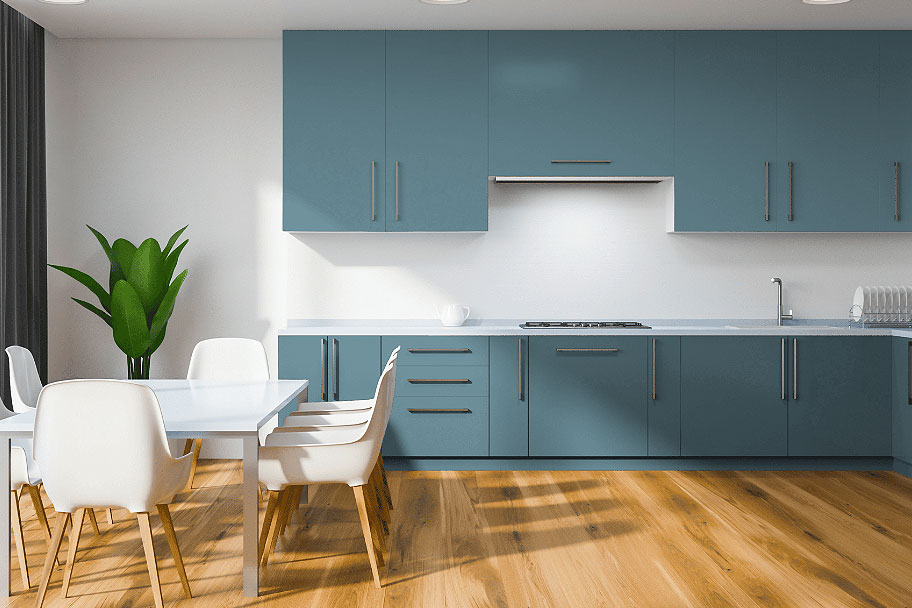 An image of a kitchen with cabinets painted in Skipping Stones by Dunn-Edwards