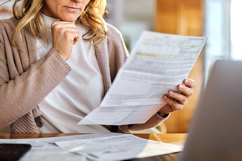 An image of a woman looking a paperwork