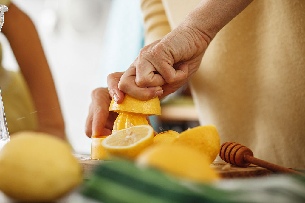 An image of a person juicing lemons