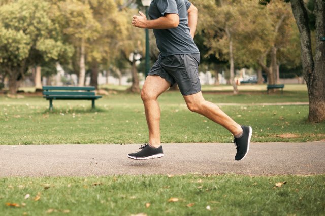 An image of a man running in a park