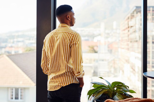 An image of a man staring out the window