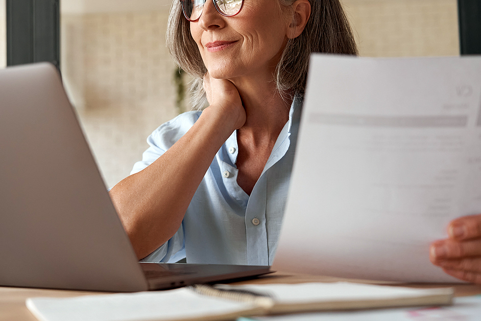 An image of a woman on a laptop