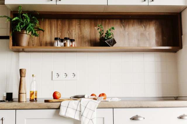 An image of a kitchen with open shelving