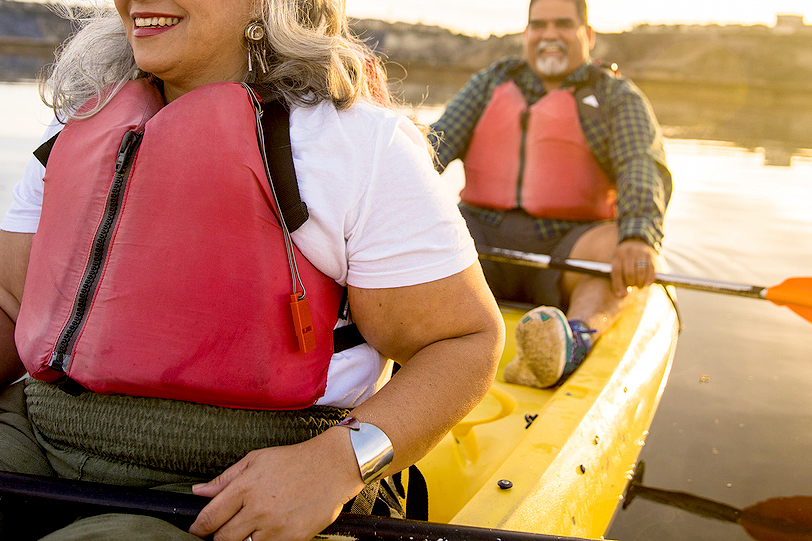 An image of a man and a woman in a canoe