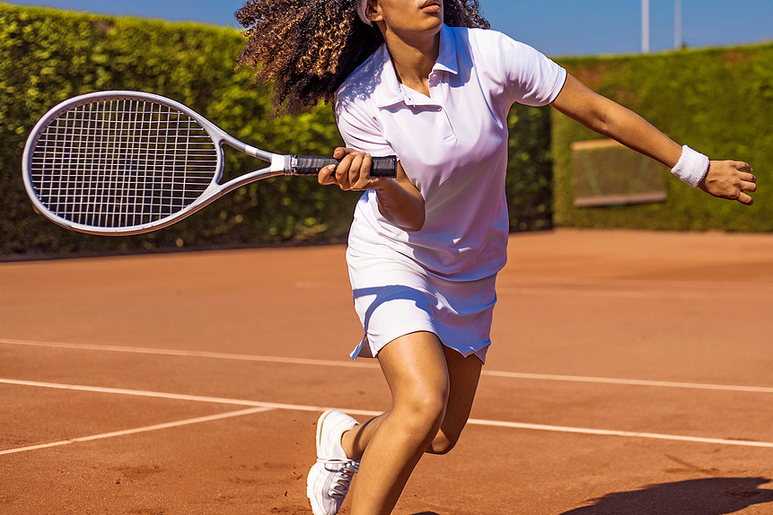 An image of a woman playing tennis