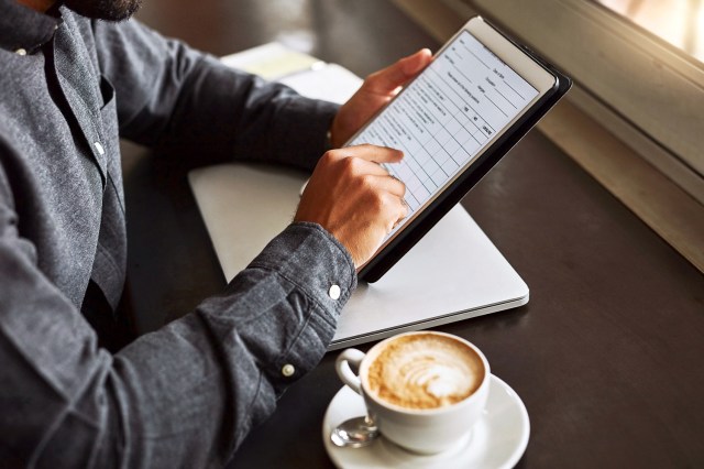 An image of a man on a tablet