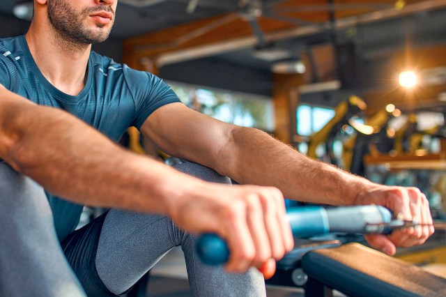 An image of a man on a rowing machine