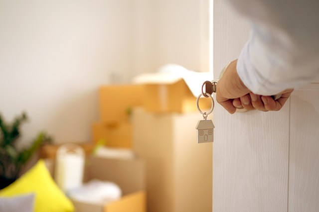 An image of a person opening a front door