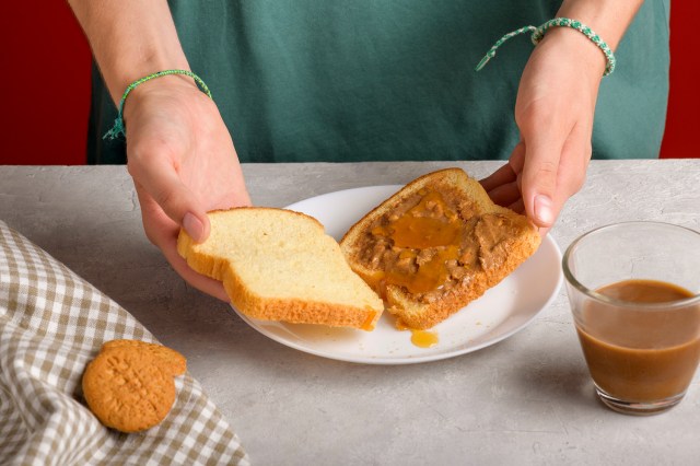 An image of a person making a sandwich