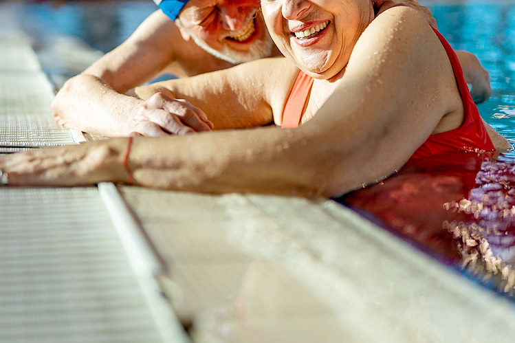 An image of a man and a woman in a pool