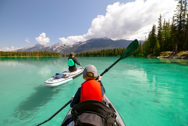 An image of two people canoeing