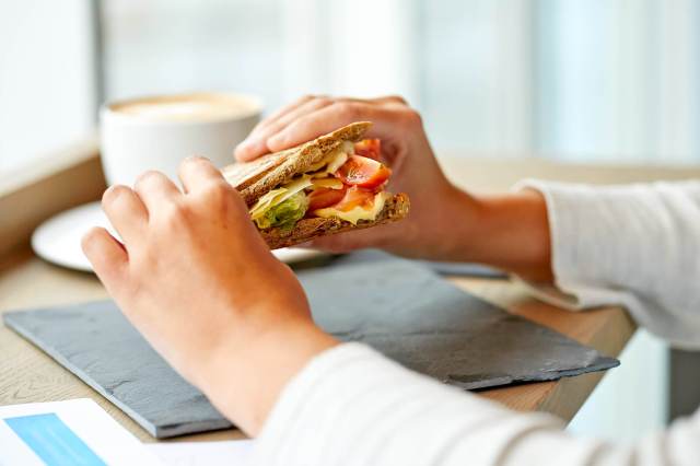 Person holding a sandwich in both hands